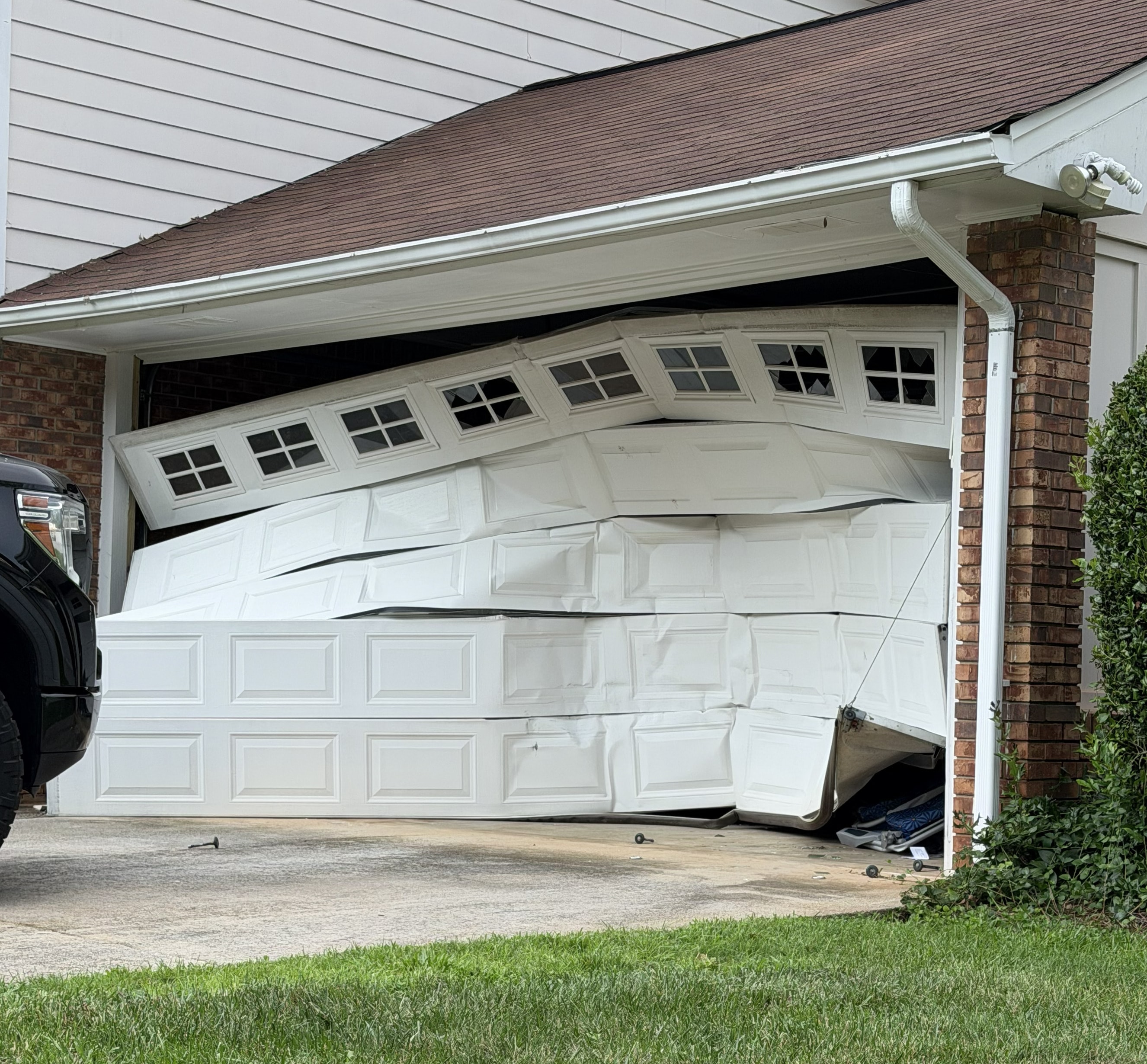 Emergency garage door service — damaged door