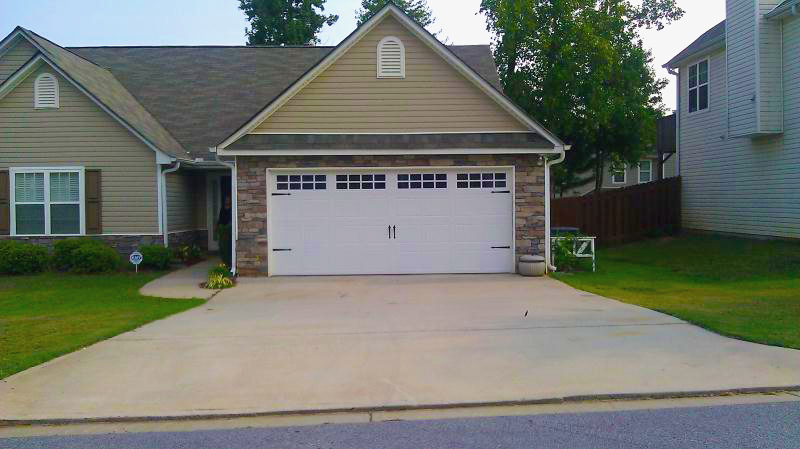 Stamp steel carriage house garage door