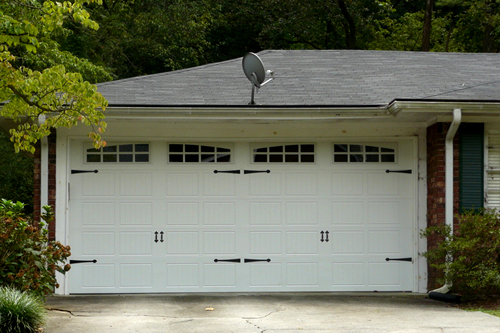 Stamp steel carriage house garage door