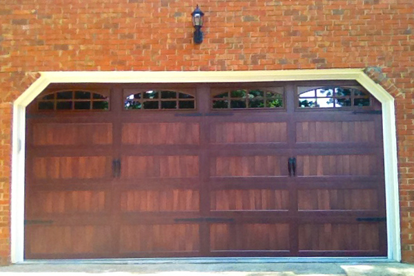 Steel garage door with wood stain look