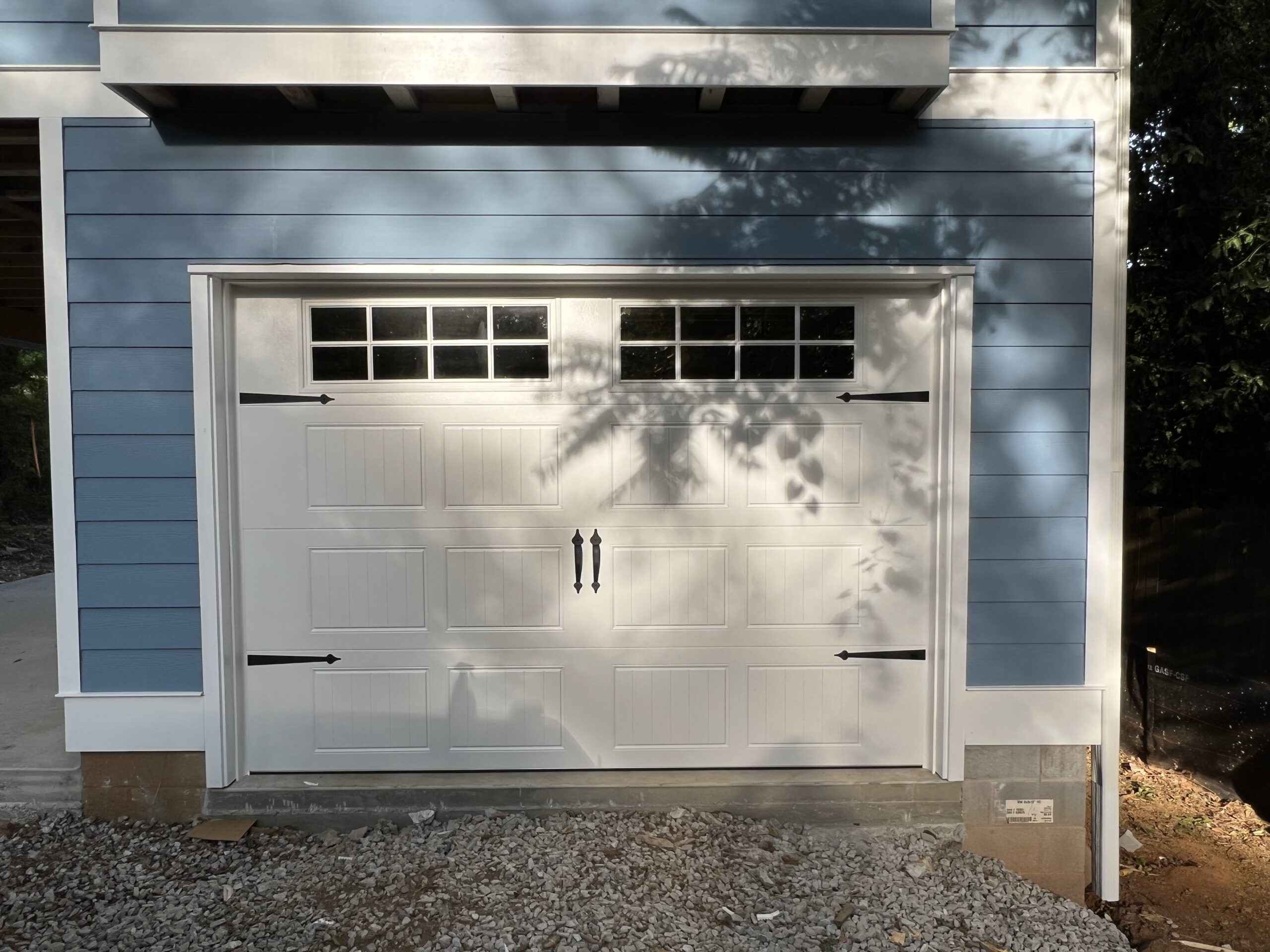 Stamp steel carriage house garage door