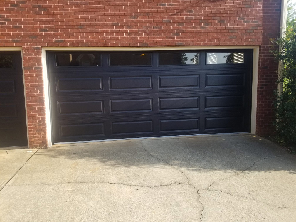 Black raised panel garage doors