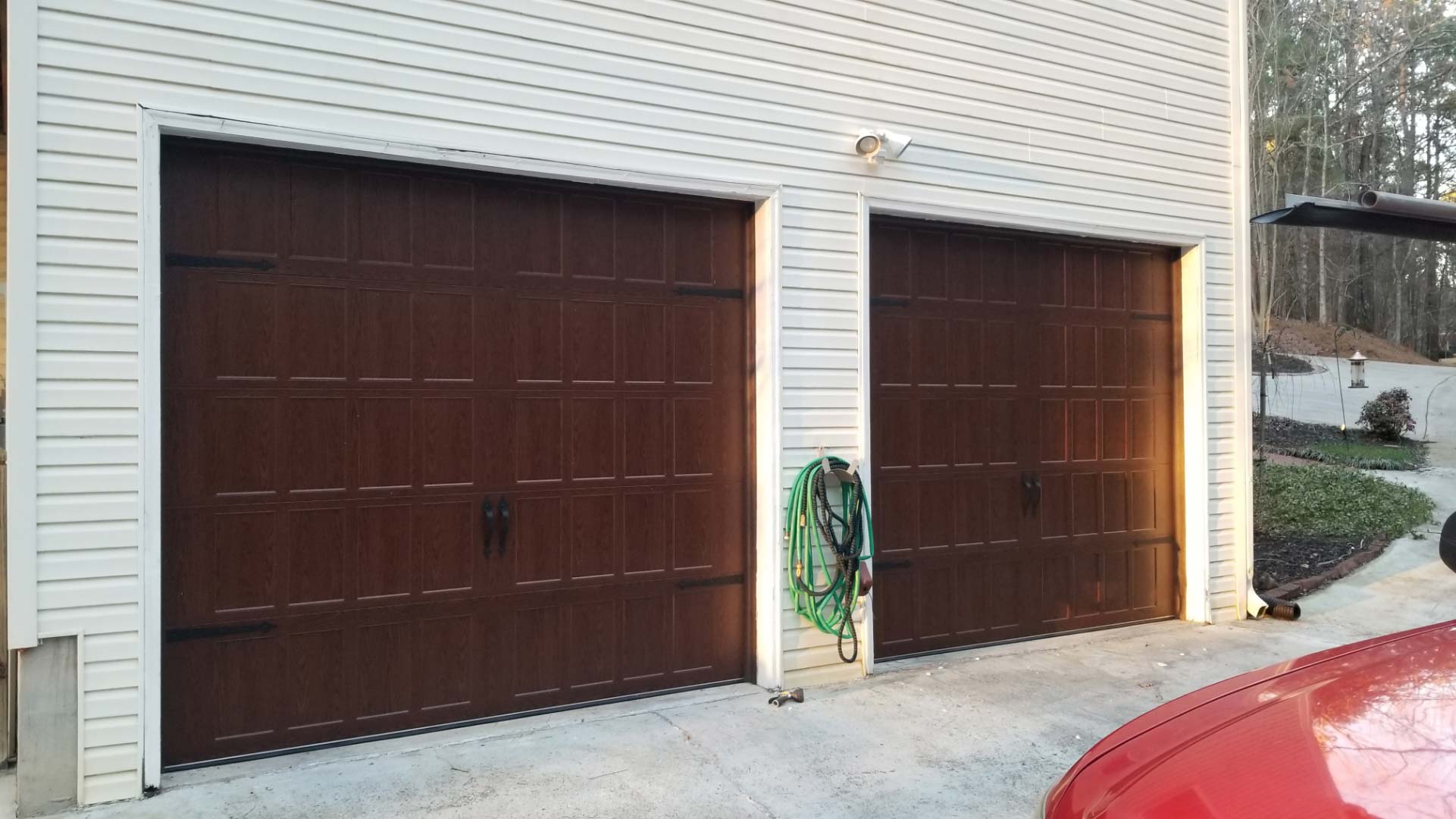 Brown steel garage door with wood stain look