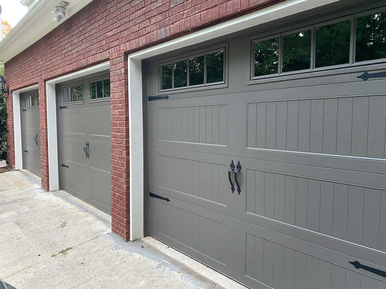 Gray stamp steel carriage house garage door