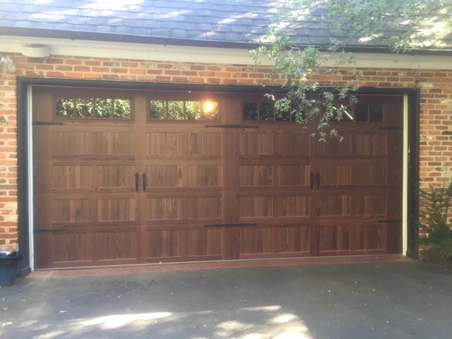Steel garage door with wood stain look