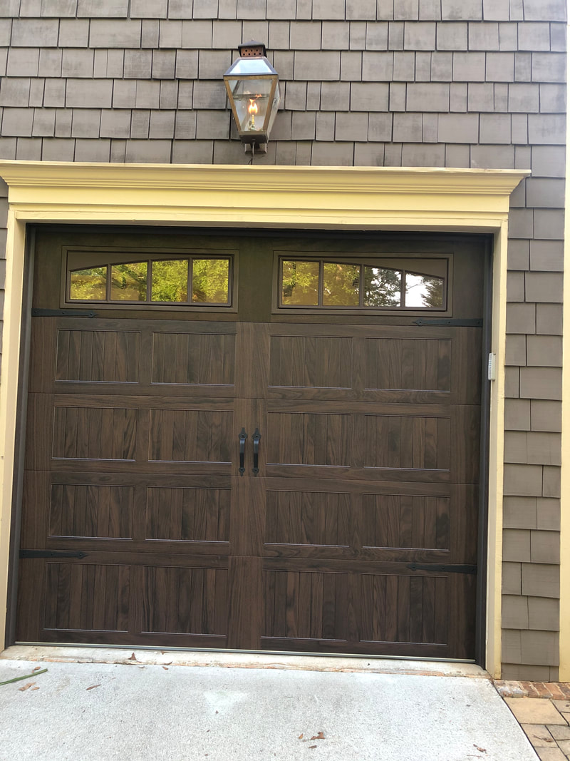 Steel garage door with wood stain look