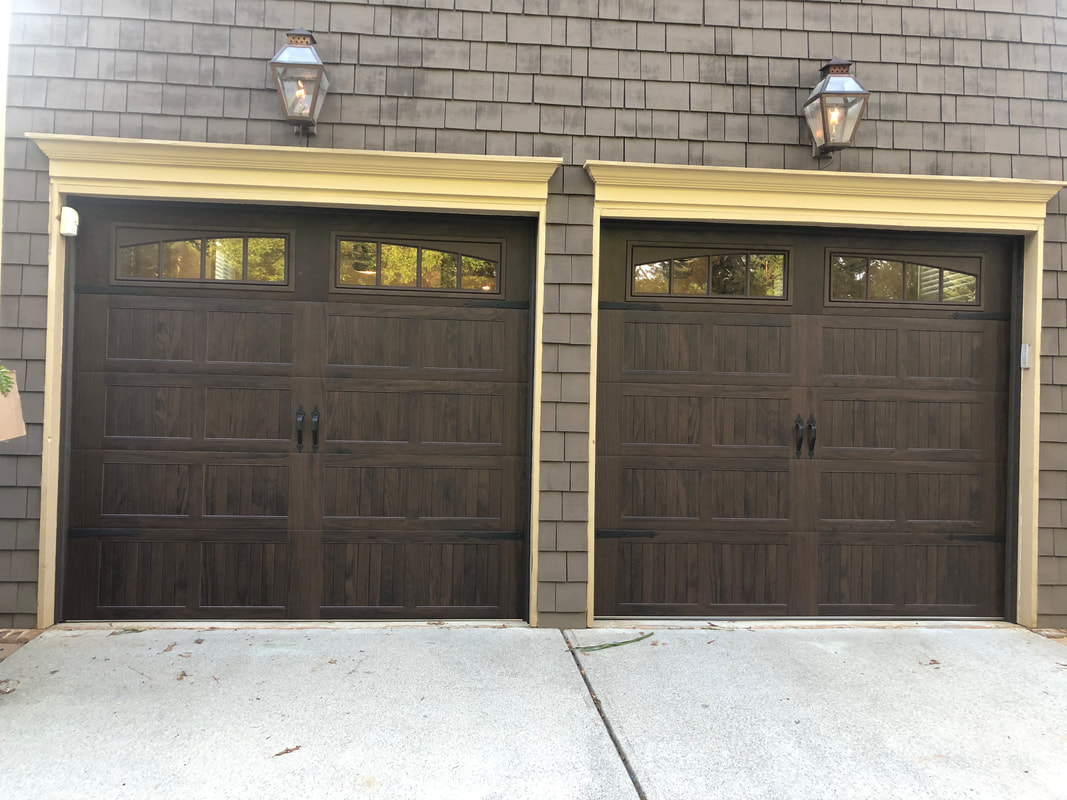 Steel garage door with wood stain finish