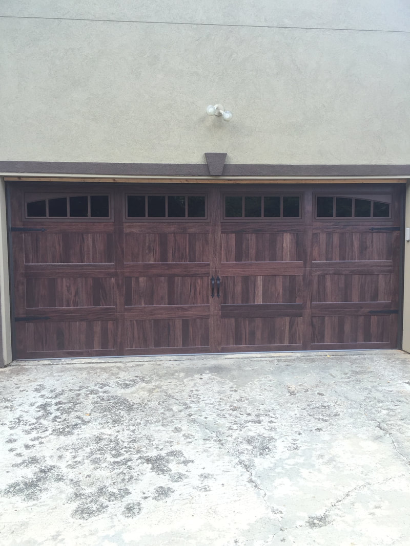 Steel garage door with wood stain look