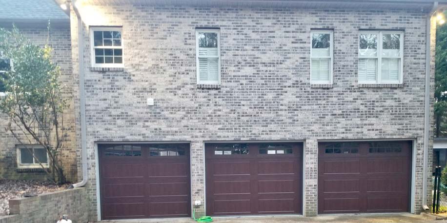 Steel garage door with wood stain finish